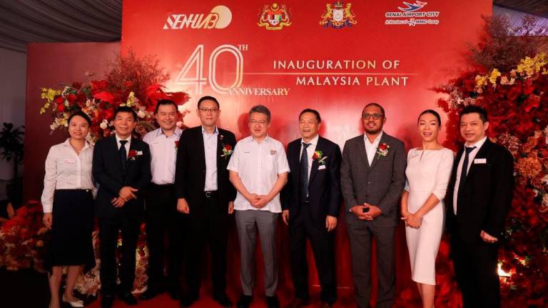 Deepening technological investments in Senai Airport City. Investment, Trade &amp; Industry deputy minister Liew Chin Tong (middle), standing with Investment, Trade, Consumer Affairs and Human Resources Committee Johor chairman Lee Ting Han, SHB CEO and Senai Airport City CEO Gan Seng Keong.