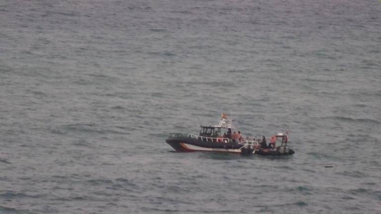 A view shows migrants sailing on a boat, as at least 54 children and about 30 adults swam from Morocco to Spain's North African enclave of Ceuta, in Ceuta, Spain July 25, 2025, in this screengrab obtained from a video. - FARO TV/Handout via REUTERSPIX