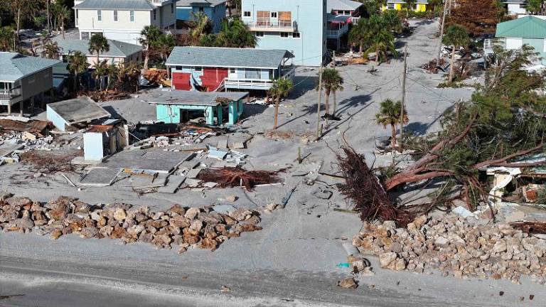 MANASOTA KEY, FLORIDA - OCTOBER 13: An aerial view of a building destroyed by Hurricane Milton on October 13, 2024 in Manasota Key, Florida. People continue recovering following the storm that made landfall as a Category 3 hurricane in the Siesta Key area of Florida on October 9th, causing damage and flooding throughout Central Florida. - Joe Raedle/Getty Images/AFP