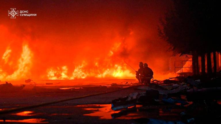 Firefighters work at the site of a private enterprise hit by a Russian drone strike, amid Russia’s attack on Ukraine, on the outskirts of Sumy, Ukraine May 15, 2025. REUTERSpix