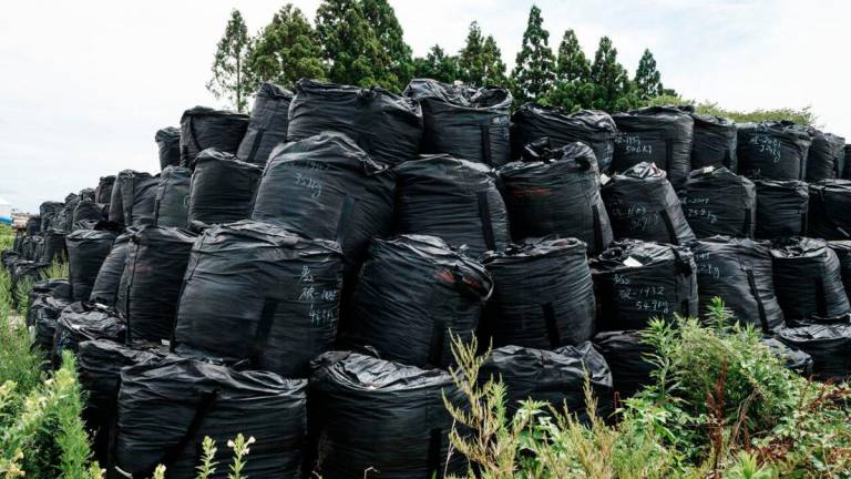 These bags held radiation-contaminated soil in in the Fukushima exclusion zone, where a Ukrainian YouTuber was arrested for trespassing. - AFP
