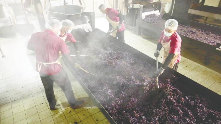 Specialised skilled workers roasting Liberica coffee beans at the Sai Kee Kopi facility.