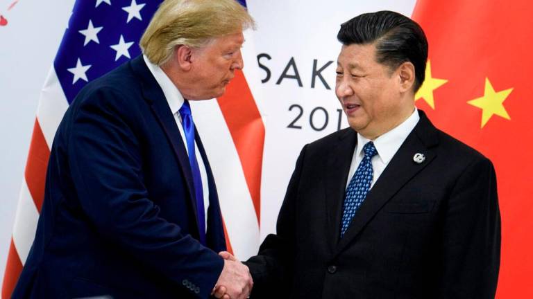 US President Donald Trump and China President Xi Jinping. -AFPpix
