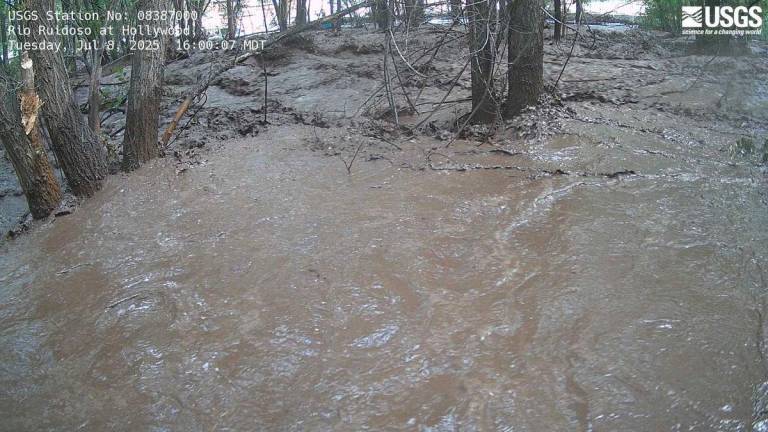 This United States Geological Survey (USGS) handout photo released by the Albuquerque National Weather Service via X (formerly Twitter) shows the flooded banks of the Ruidoso River near Ruidoso, New Mexico on July 8, 2025. (Photo by UNITED STATES GEOLOGICAL SURVEY / AFP)