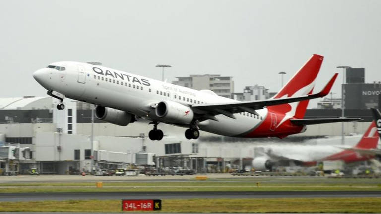 A Qantas plane takes off from the Sydney International airport on May 6, 2021. - AFP