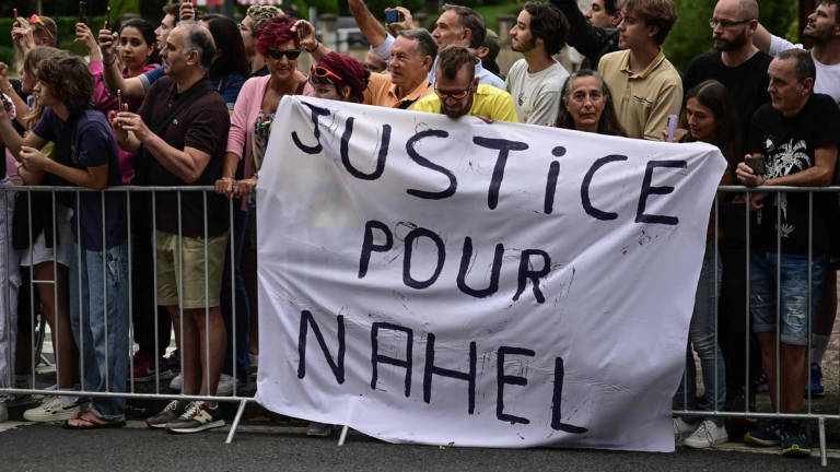 Spectator deploy a banner which reads “Justice for Nahel” along the race route at the start of the 1st stage of the 110th edition of the Tour de France cycling race. - AFPpix