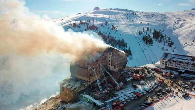 Smoke billows from the fourth floor of the 11-storey hotel in Bolu’s Kartalkaya ski resort. AFPpix