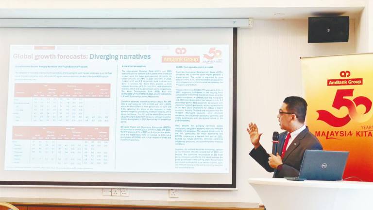 Firdaos presenting AmBank’s second-half 2025 macroeconomic outlook for Malaysia