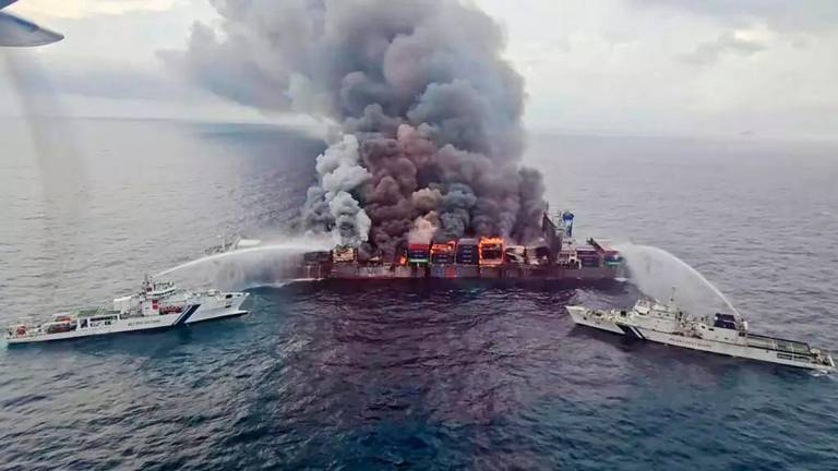 The Singapore-flagged container ship MV Wan Hai 503 caught on fire on Monday off India’s southern coast © - / Indian Coast Guard (ICG)/AFP