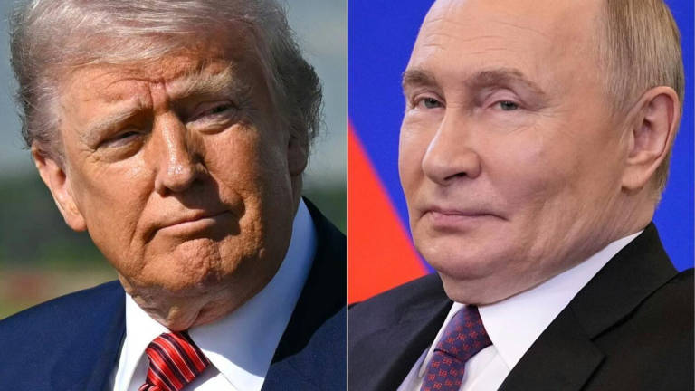 US Senators are working to pass legislation that gives President Donald Trump (L) new ‘sledgehammer’ sanctions to use against Russian President Vladimir Putin. - AFP