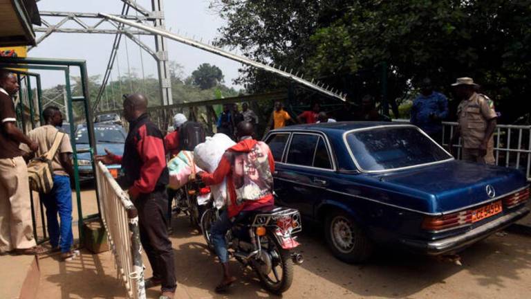 Security guards check vehicles leaving Nigeria for Cameroon at a checkpoint border between Cameroon and Nigeria in southeast Nigeria, on February 1, 2018. - AFP