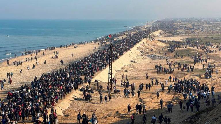 Palestinians, who were displaced to the south at Israel’s order during the war, make their way back to their homes in northern Gaza - REUTERSpix