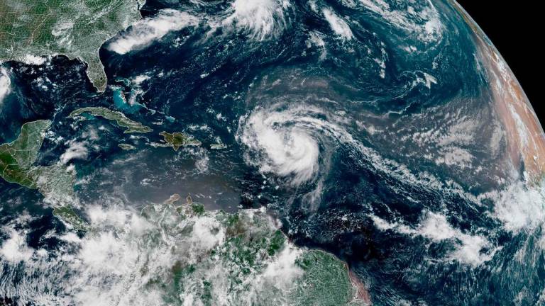 This satellite image provided by the National Oceanic and Atmospheric Administration (NOAA) shows Hurricane Erin forming in the Atlantic Ocean on August 15, 2025. Erin became the first hurricane of the season, according to the National Hurricane Center. AFP PHOTO / NOAA