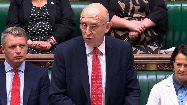 A video grab from footage broadcast by the UK Parliament's Parliamentary Recording Unit (PRU) Britain's Defence Secretary John Healey making a statement to MPs on the in the House of Commons in London on July 15, 2025, following the lifting on reporting restrictions relating to the relocation of Afghans who worked with the UK government, as a result of huge data breach in 2022. Thousands of Afghans who worked with the UK government were brought to Britain in a secret relocation programme after a huge 2022 data breach, a minister revealed Tuesday. Defence Minister John Healey told parliament about the scheme after the UK High Court lifted an order banning media from reporting that the names and details of almost 19,000 Afghans asking for asylum had been accidentally leaked just months after the Taliban seized Kabul. - AFP PHOTO / PRU