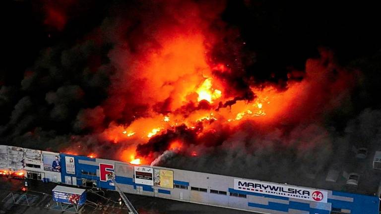 FILE PHOTO: Drone view of the Marywilska 44 shopping centre burning during a massive fire in Warsaw, Poland, May 12, 2024. - REUTERSPIX