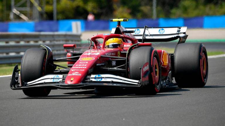 Ferrari’ British driver Lewis Hamilton attends the third practice session ahead of the Formula One Hungarian Grand Prix at the Hungaroring circuit in Mogyorod near Budapest, Hungary, on August 2, 2025. - Ferenc ISZA / AFP