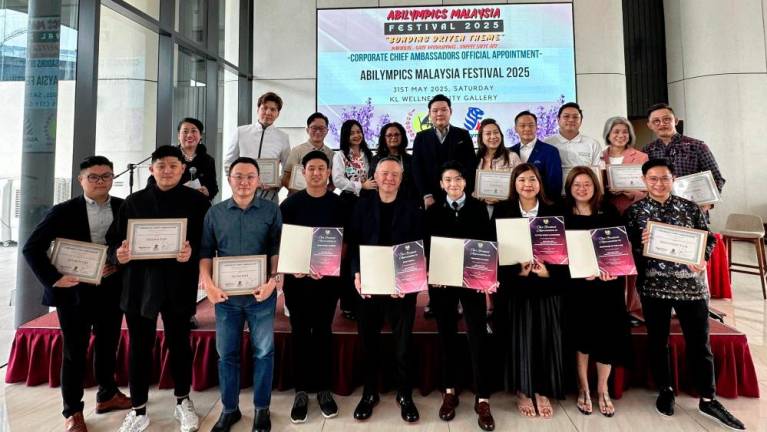 (Top row) Win Lee (4th from left) with Khatijah (5th from left) and Goh (6th from left) during the press launch of the Abilympics Malaysia Festival 2024/25 at the KL Wellness City Gallery .