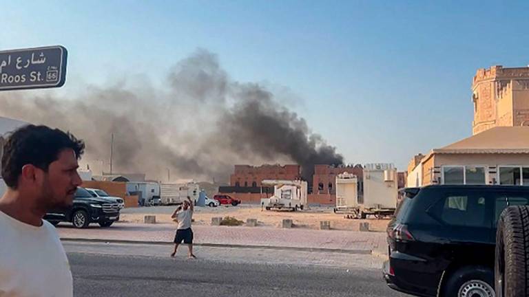 This frame grab taken from an AFPTV footage shows smoke billowing after explosions in Doha's capital Qatar on September 9, 2025. - Jacqueline PENNEY/AFPTV/AFPPIX