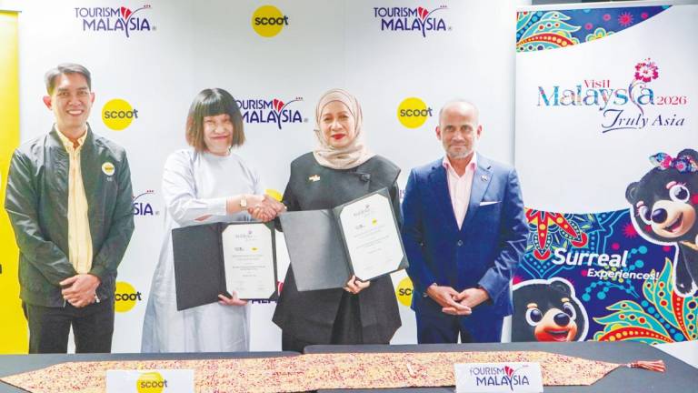 (From left) Chan, Yap, Norliza and Azfar during the signing event at the Scoot headquarters in Singapore.