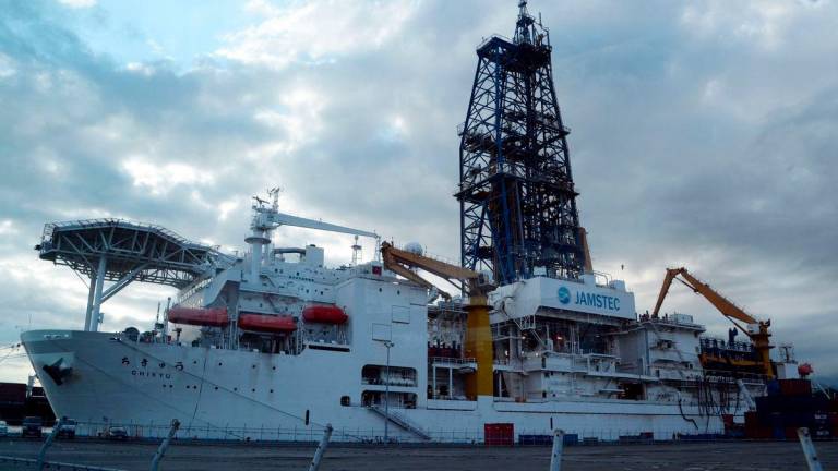 (FILES) Japan’s deep-sea drilling vessel Chikyu is seen anchored at a pier in Shimizu port, Shizuoka prefecture on September 11, 2013. (Photo by TOSHIFUMI KITAMURA / AFP)