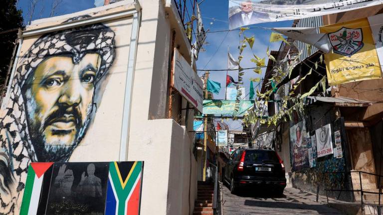 A view shows art on the wall of a building depicting late Palestinian leader Yasser Arafat at Mar Elias Palestinian refugee camp, ahead of Palestinian President Mahmoud Abbas’s visit to Lebanon, in Beirut, Lebanon May 20, 2025. REUTERSpix