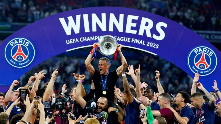 Paris St Germain coach Luis Enrique lifts the trophy. Reuterspix