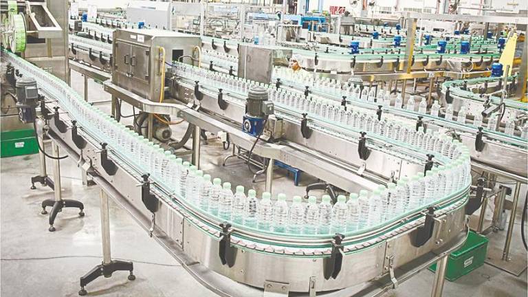 View of a Spritzer production line. The company continues to introduce sustainable packaging alternatives for its bottled water products. – Spritzer website pic