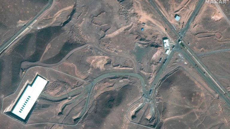 This handout satellite image courtesy of Maxar Technologies shows cargo trucks postioned near an underground entrance to Iran’s Fordow Fuel Enrichment Plant (FFEP), in Fordo, Iran on June 20, 2025. - AFP PHOTO / Satellite image ©2025 Maxar Technologies