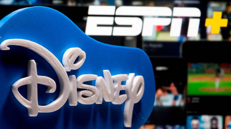 FILE PHOTO: A 3D printed Disney logo is seen in front of the ESPN+ logo in this illustration created on July 13, 2021. REUTERS/Dado Ruvic/Illustration/File Photo
