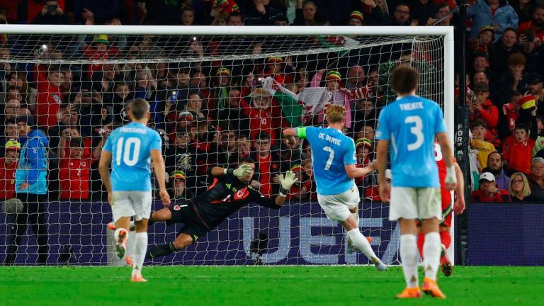 Belgium’s Kevin De Bruyne scores their third goal from the penalty spot past Wales’ Karl Darlow Action. Images via Reuters