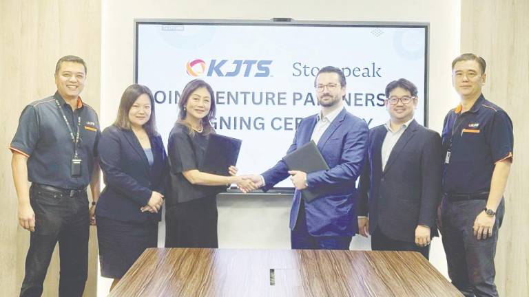 From left: KJTS Group executive director Sheldon Wee, independent non-executive director Elaine Law Soh Ying, Azura, Stonepeak investment team managing director Zach Ennis, KJTS Group independent non-executive director Ng Kok Ken and group managing director Lee Kok Choon at the signing ceremony.