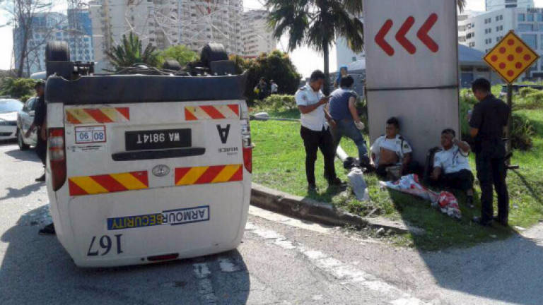Armoured van carrying RM4m turns turtle, guards injured, money safe