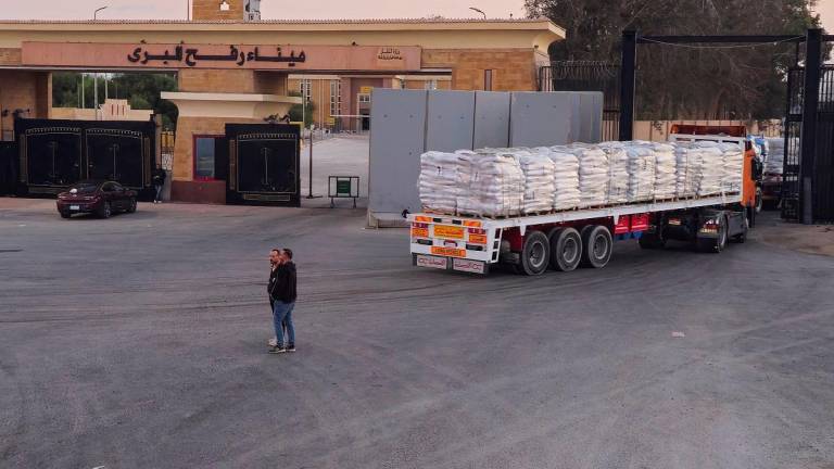 Trucks carrying humanitarian aid enter the crossing into the Gaza Strip at the Rafah border on the Egypt side, amid a ceasefire between Israel and Hamas in Gaza, in Rafah, Egypt, October 17, 2025. - REUTERS/Stringer