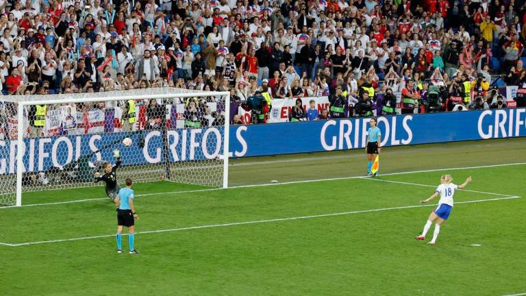 England’s Chloe Kelly scores the winning penalty in the penalty shootout - REUTERS