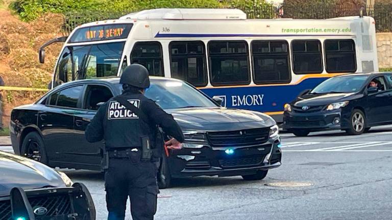 Atlanta Police lock down the streets around the Center for Disease Control (CDC) during an active shooter event in Atlanta, Georgia on August 8, 2025. On August 8, 2025, a suspect armed with multiple firearms opened fire near Emory University and the CDC in Atlanta, Georgia. A police officer was injured and the shooter is dead. - Photo by John Falchetto / AFP