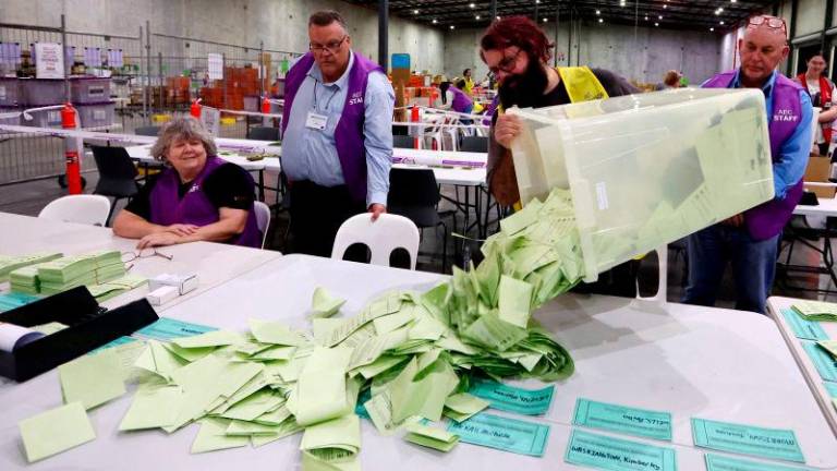 Australian Electoral Commission staff prepare to count ballots during the 2025 federal election at OPC in Brisbane, Australia, May 3, 2025. AFPpix
