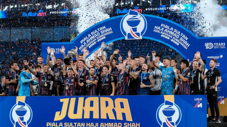 The JDT team celebrated their victory by clinching the Sultan Haji Ahmad Shah Cup after defeating Selangor FC with a 3-0 score in the 2025 Charity Shield match at the Sultan Ibrahim Stadium yesterday. – BERNAMA