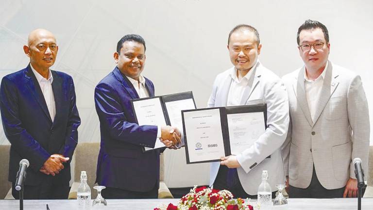Berjaya Land group executive director Datuk Abdul Rahim Mohd Zin, Syed Ali, Chua and business development director Lim Chek Lim at the memorandum of understanding signing ceremony Berjaya Land and Sibs. – AMIRUL SYAFIQ/THESUN