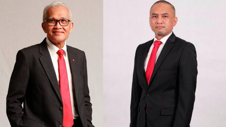 - Tan Sri Mohd Nasir Ahmad (L) and Amir Hamdan.