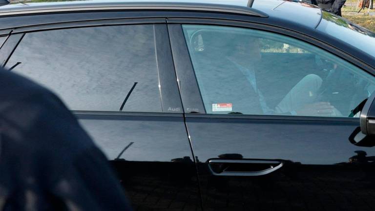A black Audi driven by Christian B’s lawyer Friedrich Fuelscher and believed to be carrying Christian B is seen driving out of the high-security prison ‚Justizvollzugsanstalt Sehnde‘, where imprisoned Christian B, suspect in Madeleine McCann’s disappearance is due to be released on September 17, 2025, in Sehnde near Hanover, northern Germany. - Odd ANDERSEN / AFP