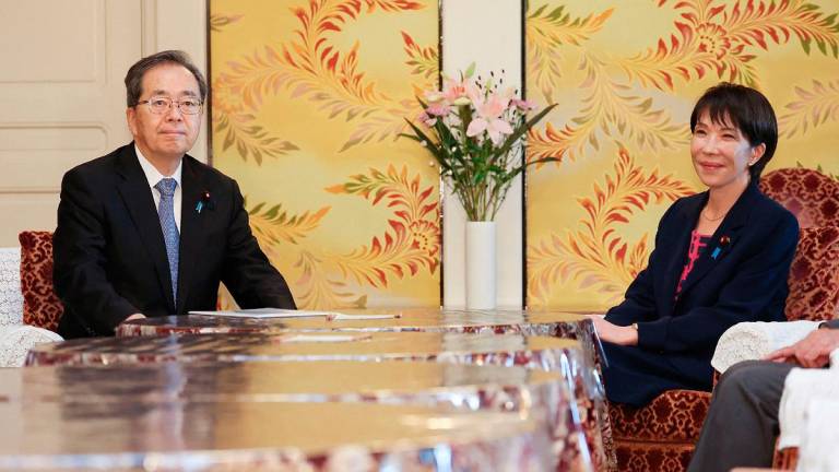 Japan’s Liberal Democratic Party (LDP) President Sanae Takaichi (R) and Komeito Party leader Tetsuo Saito attend a meeting of party leaders at the Diet in Tokyo on October 10, 2025. - JIJI PRESS / AFP