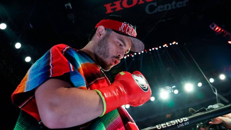 (FILES) Mexico’s Julio Cesar Chavez Jr. enters the ring ahead of his cruiserweight boxing bout against USA’s Jake Paul at the Honda Center in Anaheim, California, on June 28, 2025 - AFP