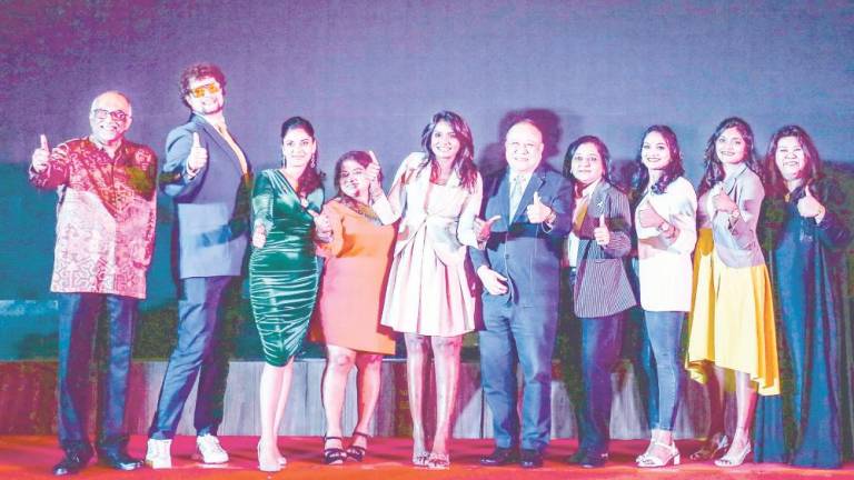 Lavaniyah (fifth from left) standing next to CCAM vice-president Chua Keng Soon, and other officials during the Gala Night Fundraising Dinner to raise awareness and funds for children battling cancer in Malaysia. – ADAM AMIR HAMZAH/THESUN