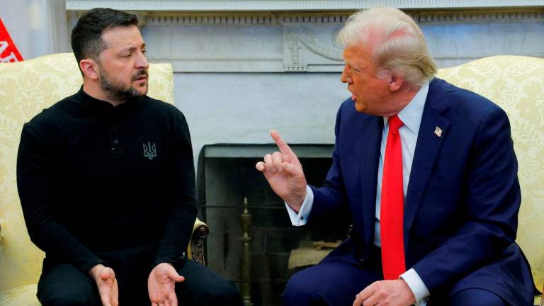 FILE PHOTO: U.S. President Donald Trump meets with Ukrainian President Volodymyr Zelenskiy at the White House in Washington, D.C., U.S., February 28, 2025. REUTERS/Brian Snyder/File Photo