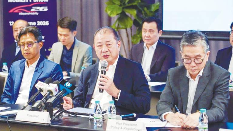 From left: MAA vice-president Sarly Adle Sarkum, Mohd Shamsor and vice-president Tan Keng Meng at the press conference to review the performance of motor traders and manufacturers for the first half of 2025. – AMIRUL SYAFIQ/THESUN