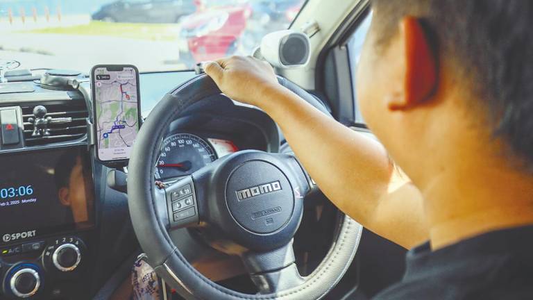 E-hailing drivers are finding it difficult to make ends meet due to falling incomes. – AMIRUL SYAFIQ/THESUN