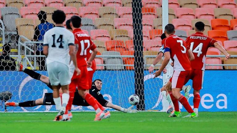 Iraq’s Zidane Iqbal scores their first goal. - REUTERS/Stringer