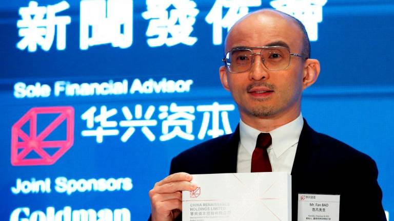 FILE PHOTO: Bao Fan, founder, Chairman and CEO of China Renaissance Group, an investment bank led by one of the country’s most famed rainmakers, holds a news conference on its IPO in Hong Kong, China September 13, 2018. REUTERS/Bobby Yip/File Photo