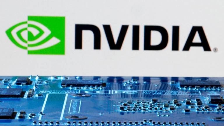 Nvidia’s logo is seen near computer motherboard in this illustration. – Reuterspic
