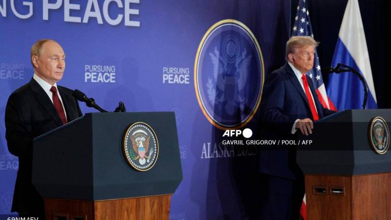 In this pool photograph distributed by the Russian state agency Sputnik, US President Donald Trump (R) and Russian President Vladimir Putin hold a joint press conference following a US-Russia summit on Ukraine at Joint Base Elmendorf-Richardson in Anchorage, Alaska, on August 15, 2025. - Gavriil GRIGOROV / POOL / AFP